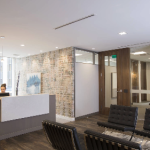 Woman working reception office during day 150x150